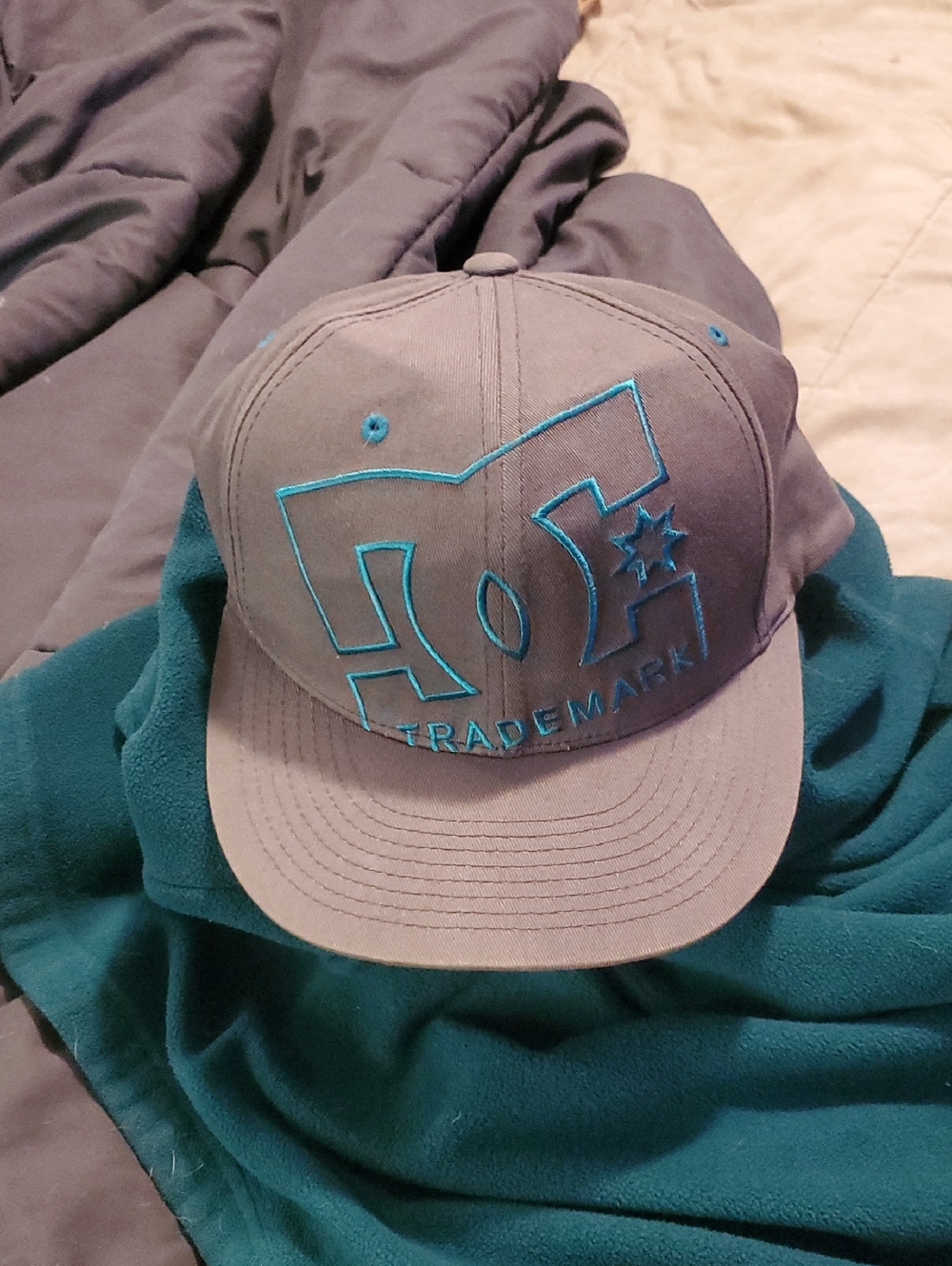DC Gray Hat with Teal Embroidered Logo..Flexfit...